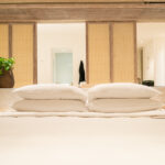 white pillows in luxury hotel resort bedroom