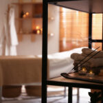 aromatic-incense-sticks-burning-candles-and-towels-in-spa-salon-interior-design
